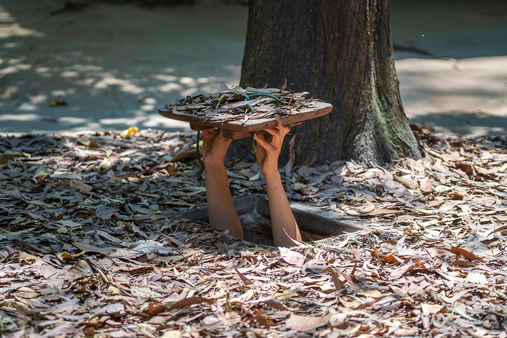 Tourist at the entrance of Cu Chi Tunnels in Ho Chi Minh, Vietnam, closeup